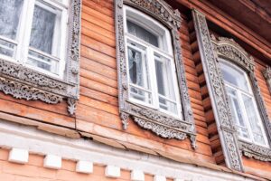 Beautiful-old-windows-architectural-monument-old-russian-style-wooden-architecture-old-carved-frame-architectural-decorative-element
